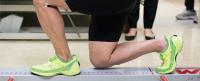 A person performing a kneeling exercise.